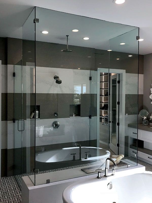 Heavy frameless glass shower door in Greenville South Carolina.